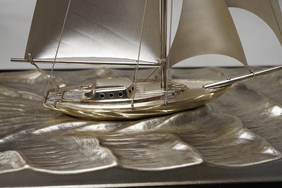 A modern sterling miniature model of 'Yacht No.6 Cutter' by Takehiko, in a presentation case, fixed on a wooden base, yacht dimensions approximately height 13.4cm, length 15cm, with box and pamphlet.